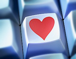 Heart shape symbol on computer key --- Image by © Matthias Kulka/Corbis