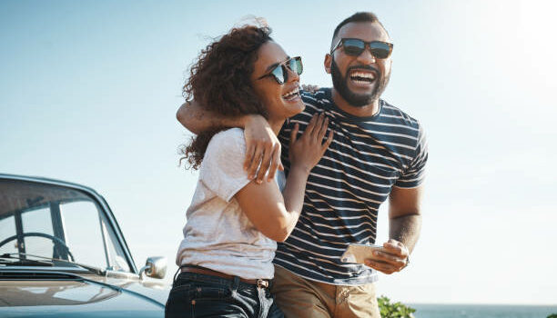 Is Summer a Good Season for Dating? The Pros and Cons of Warm Weather Wooing Shot of a young couple enjoying a summer’s road trip together